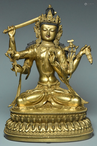 A GILT BRONZE MANJUSHRI YONGLE MARK AND PERIOD