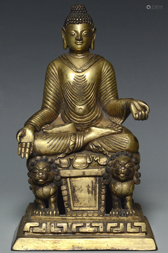 A YUAN DYNASTY GILT BRONZE FIGURE OF BUDDHA