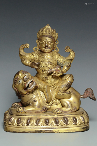 A QING DYNASTY GILT BRONZE FIGURE OF VAISHRAVANA