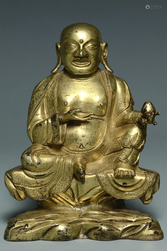 A QING DYNASTY GILT BRONZE FIGURE OF BUDDHA