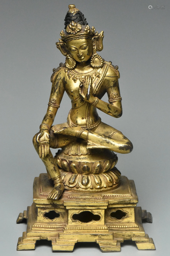 A YUAN DYNASTY GILT BRONZE FIGURE OF MAITREYA