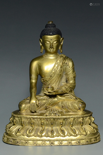 A MING DYNASTY GILT BRONZE FIGURE OF BUDDHA