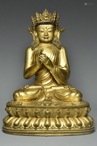 MING DYNASTY GILT BRONZE FIGURE OF BUDDHA 15TH C