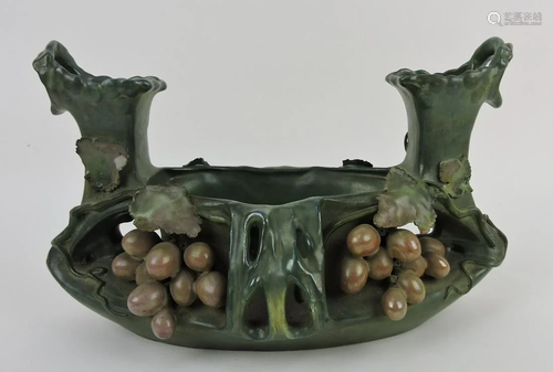 Amphora planter with grape motif,