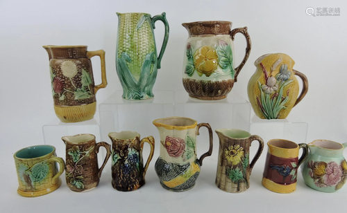 Majolica lot of 10 pitchers and 1 mug,