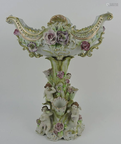 Porcelain table center with cherubs, 16 1/2