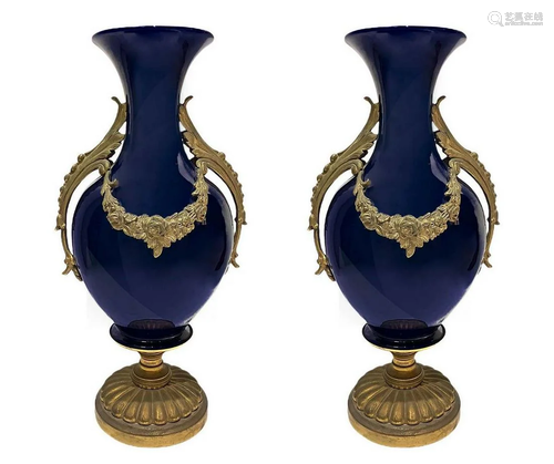 Pair of white porcelain vases with gilded bronze