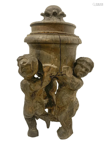 Raised wooden with three cherubs and cover nineteenth