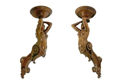 Wooden sculptures depicting female caryatids circular