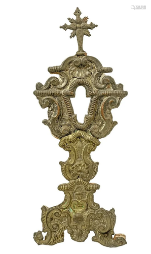 Monstrance in wood, covered with embossed brass relief,