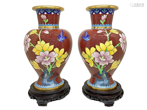 Pair of metal vases with floral decoration, XX century.