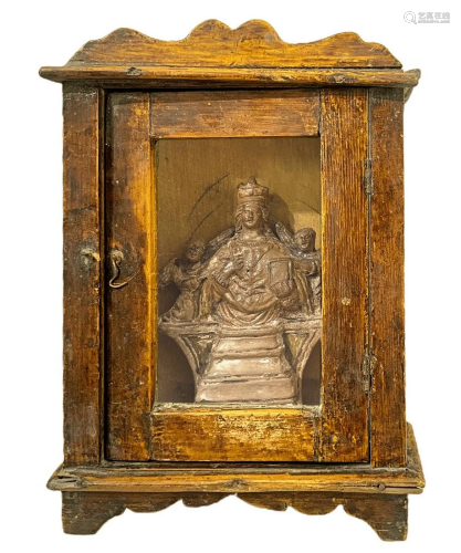 Small casket containing wooden carving of St. Agatha,
