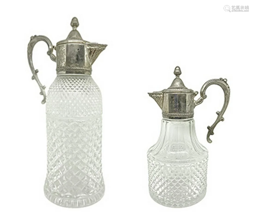 Couple of carafes glass ashlar with metal handle. H 32.