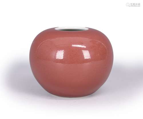 A red glazed porcelain water pot