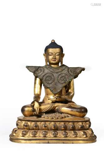 A gilding copper sitting buddha statue