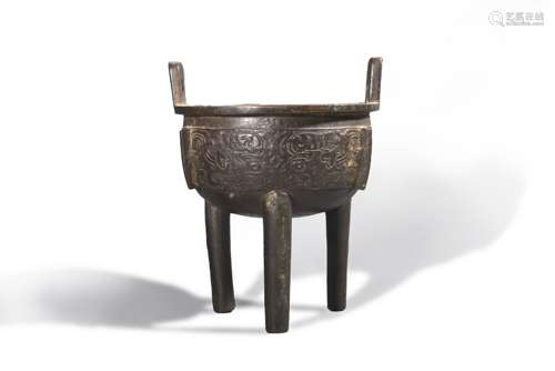 A taotie patterned three-legged copper vessel