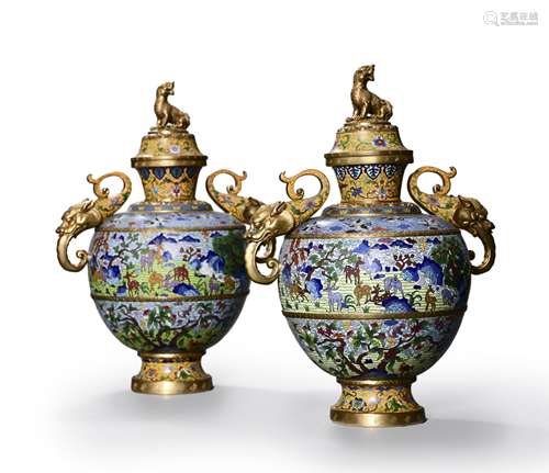 A pair of cloisonne enamel loop-handled vases with dragon-sh...