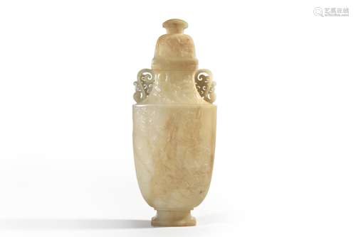 A carved white jade vase