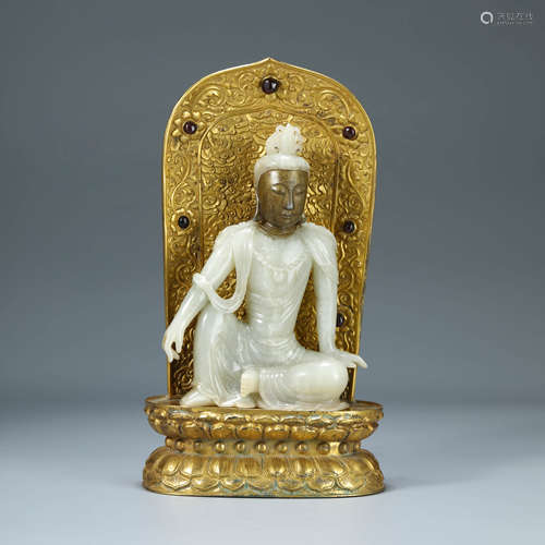 A CARVED WHITE JADE SEATED GUANYIN