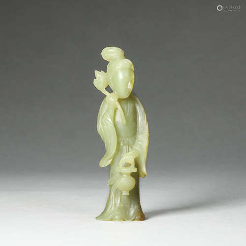 A CARVED CELADON JADE LADY