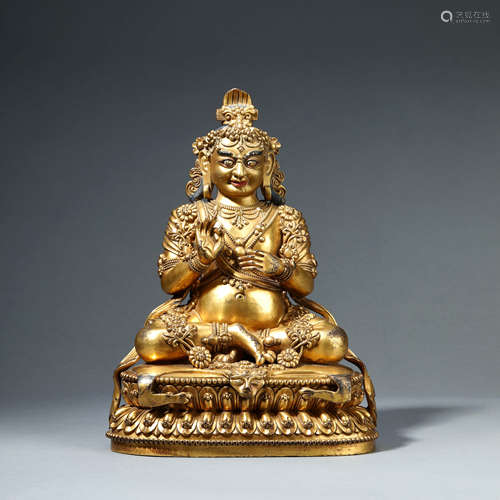 A GILT-BRONZE SEATED KUBERD