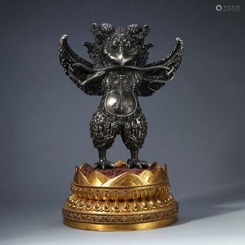 A SILVER GARUDA WITH GILT-BRONZE STAND