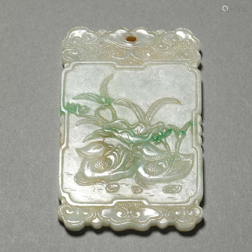 A CARVED JADEITE PLAQUE