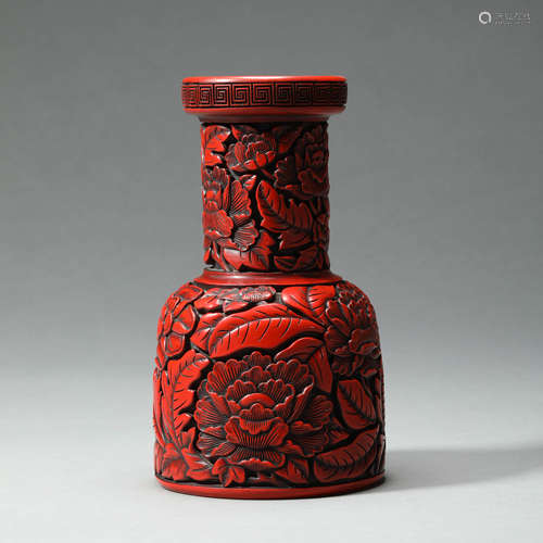 A CARVED CINNABAR LACQUER VASE