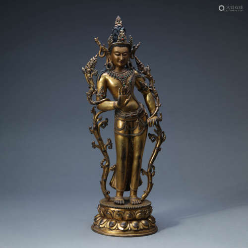 A GILT-BRONZE STANDING GREEN TARA