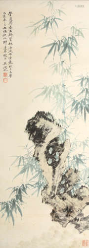 A CHINESE PAINTING OF BAMBOO ON ROCK