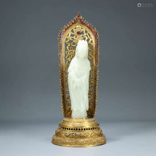 A CARVED WHITE JADE STANDING GUANYIN