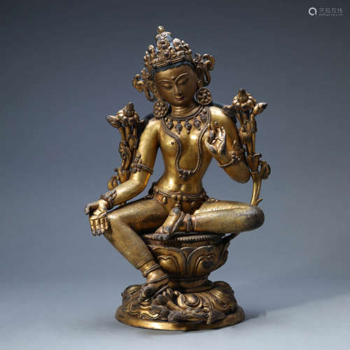 A GILT-BRONZE SEATED GREEN TARA