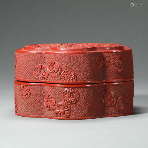 A CARVED CINNABAR LACQUER BOX WITH COVER