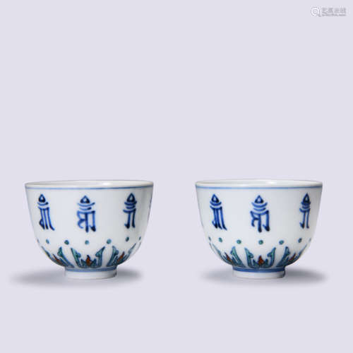 A PAIR OF  BLUE AND WHITE SANSKRIT CUPS