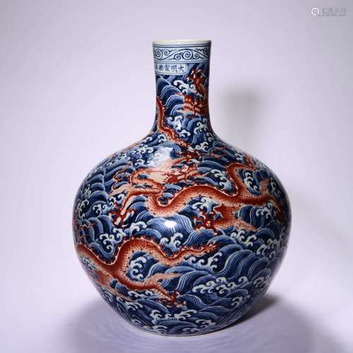 AN UNDERGLAZE BLUE AND IRON RED GLOBULAR VASE