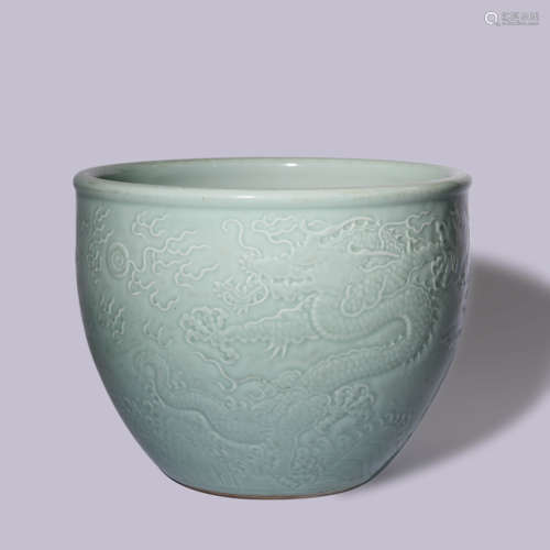 A CELADON GLAZED DRAGON JARDINIERE