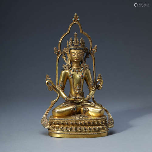 A GILT-BRONZE SEATED GREEN TARA