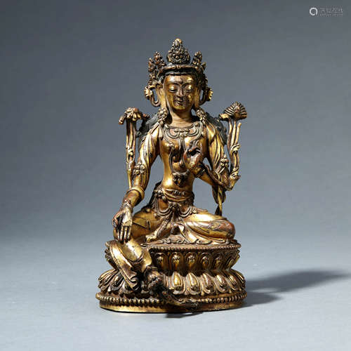 A GILT-BRONZE SEATED GREEN TARA