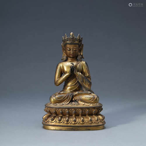 A GILT-BRONZE SEATED KSITIGARBHA