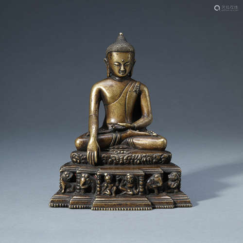 A COPPER ALLOY SEATED SHAKYAMUNI