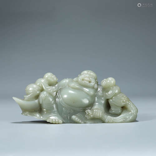 A CARVED CELADON JADE BUDAI WITH CHILD