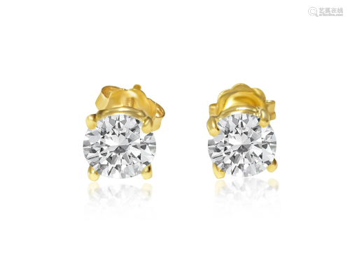 1.20 carat diamond studs in 14kt yellow gold. Custom