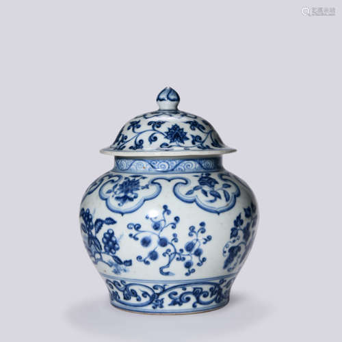 A BLUE AND WHITE JAR WITH COVER