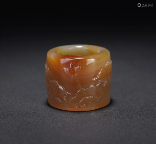 A CHINESE AGATE LOTUS-POND-SCENE ARCHER'S RING