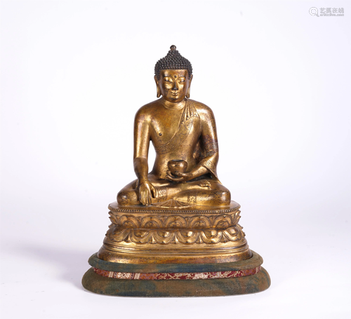 A CHINESE GILT BRONZE FIGURE OF SEATED BUDDHA