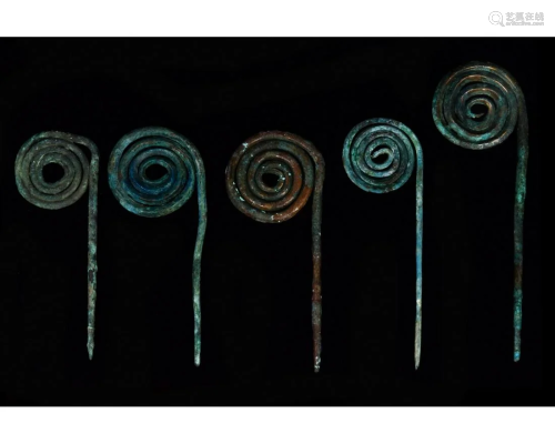 FIVE BRONZE AGE COILED PINS