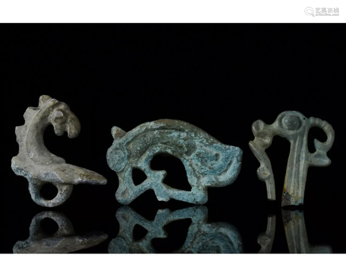 THREE SCYTHIAN BRONZE ZOOMORPHIC MOUNTS