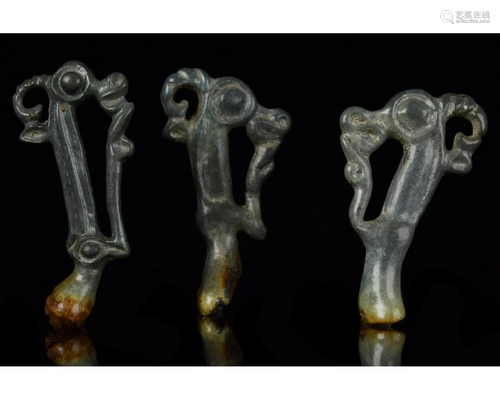 THREE SCYTHIAN BRONZE ZOOMORPHIC FITTINGS