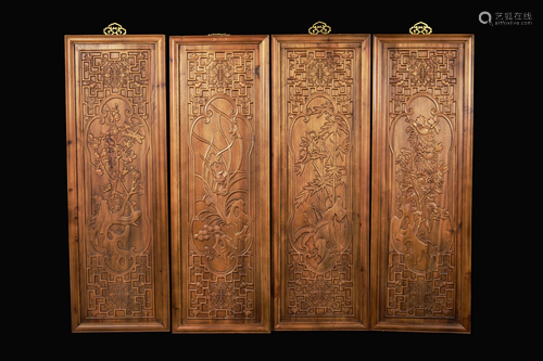 A Set of Four Chinese Camphor Wood Hanging Panels