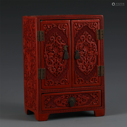 A CHINESE CARVED LACQUER CABINET